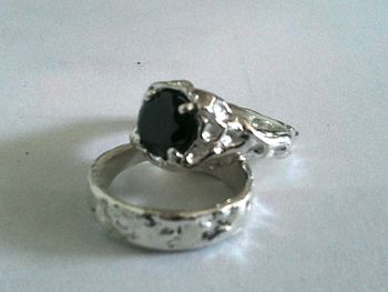 Platinum wedding set with black diamond center stone
