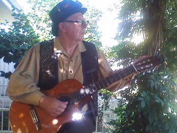 Steve playing (about to play?) the guitar

