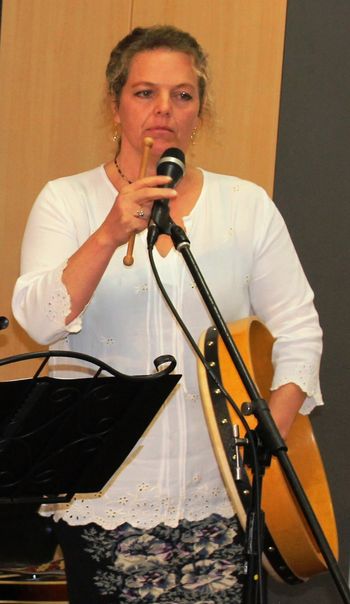 Barbs playing (about to play?) the bodhran
