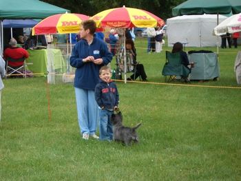 Thomas in the baby handlers with a Cairn terrier
