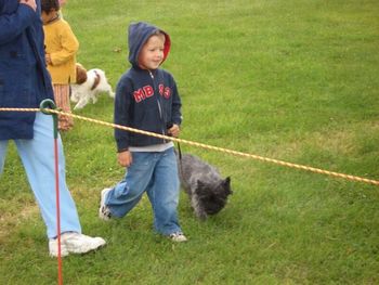 Thomas in the handlers with a Cairn terrier
