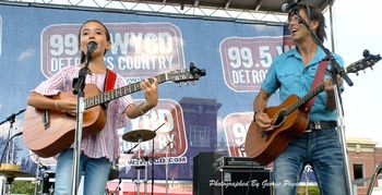 w Kira Blue onstage at Arts Beats and Eats
