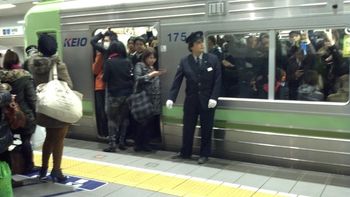 That attendant will push people in to get the doors to shut.
