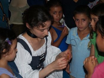 Adrielle making origami for the kids.
