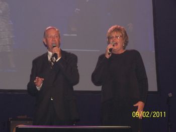 Close up of Debbie and Ernis on main stage.
