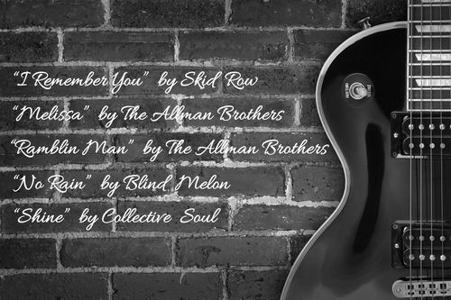 Guitar against a brick wall