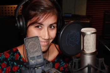 Happy, despite discomfort of mic growing out of face.
