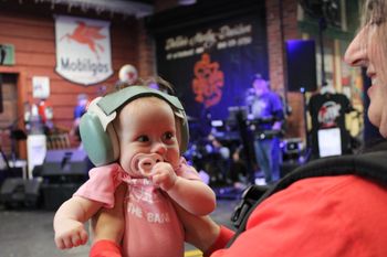 Little Lila Yarnal taking in her first rock show with her daddy strummin' the bass - how cute is that?
