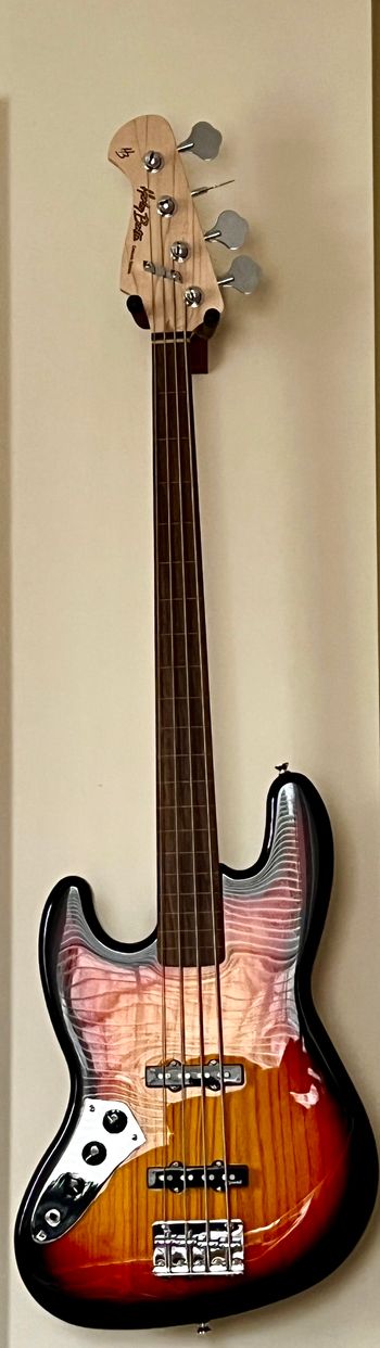 The newest member of the family; purchased online in 2025.  Harley Benton is an inexpensive brand sold by Thomann in Germany.  Very highly rated, and so far I dig it.  I always wanted a fretless and when these were back in stock I snapped one up.  Now has a set of LaBella Deep Talkin' Flatwound strings on it.
