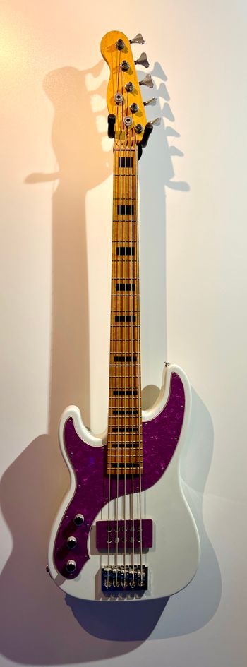 Homemade from Warmoth parts 5 string bass.  Heavy, heavy, heavy bass.  Custom Stonewall pickup and the pick guard and pickup cover were custom made by Scott at Stonewall.

