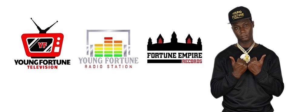 Young Fortune poses with all of his brand logos. Young Fortune Television logo, Young Fortune Radio Station logo, and Fortune Empire Records logo