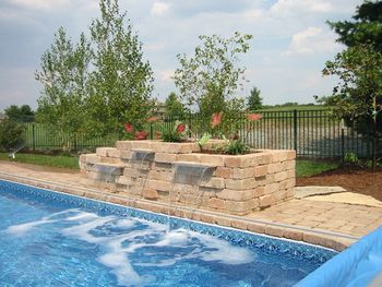 This planter includes a water feature connected directly to the swimming pool Note the protruding blocks - Our customer came up with the idea to accent the planter with the blocks protruding. Working with you to bring creative design is rewarding for everyone
