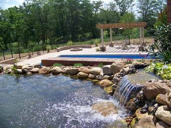 Upper patio views pool / fire pit / pergola and water feature with running stream Truly a home away from home in your own back yard
