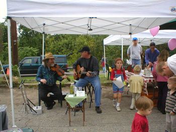 Ted & John Dodd playing at the local Farmer's Market way too early in the Morning!
