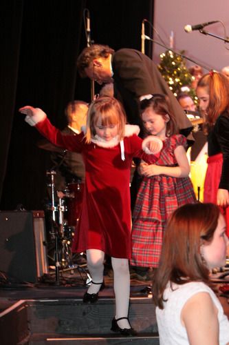 Ken Carroll helping the kids on stage.
