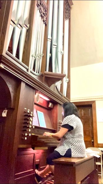 Rehearsing organ music to play for a Catholic church wedding ceremony in Connecticut
