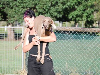 Aimee saving Wisper from a group of puppies
