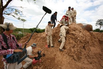Director/cinematographer Kim Mordaunt, sound recordist Dan Miau film Laith, Lin & team dealing with live warhead
