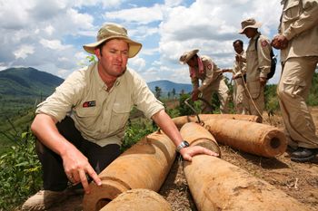 Laith Stevens examines bombs in Ta Oi Province, Laos
