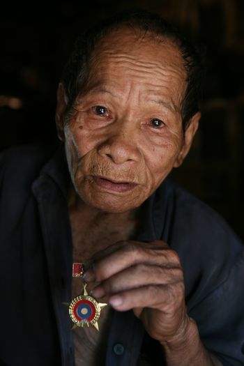 Mr Pom remembers the bombs raining on his village on the Ho Chi Minh Trail, Laos
