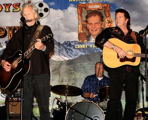 Johnny Cash tribute artist Steve Waddington and Cashin In performing live on stage backing country music legend Kris Kristofferson in concert