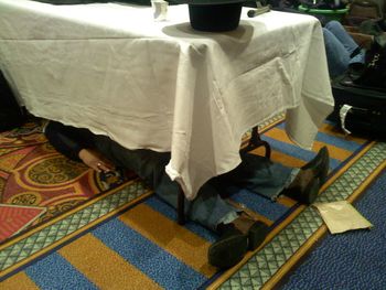 
We then flew the next day...with no sleep...from Austin to NYC to perform a showcase for Performing Arts Centers in Midtown Manhattan and Keith caught a few winks under a table in our green room!


