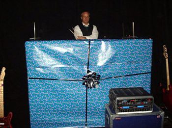 2006-
NFR 06 / Our friend JJ at KTHQ
A trip to the White Mountains would never be complete without a visit to KTHQ in
Pinetop, AZ. Our friend JJ has been faithfully playing our music for almost ten
years. We always have fun visiting the station and love the opportunity to perform
"live" on the air.
We had a great time at the Excalibur during NFR. We thought we'd all get in the
Christmas spirit by gift wrapping Perry's drum booth. It was funny for about an
hour, then we decided to unwrap him!
