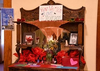 Grief altar at the "Love, the Heartache" release show, July 2025. Gratitude to Lauren MacDonald & others for helping create this. Photo by Roger Averbeck.

