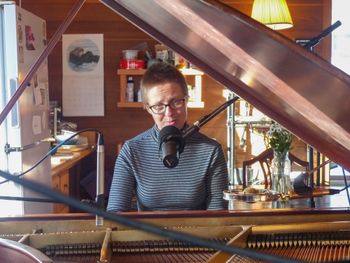 In the recording studio, aka my kitchen, Jan. 2025. Photo by Elliott Mazzola.
