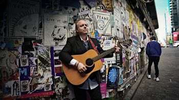 Taken on location in Seattle during the filming of the music video for "One Day".
