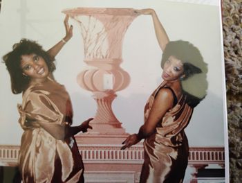 Evette and Barbara holding up the wallpaper in our room, San Fransisco...
