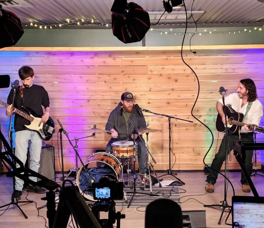 andrew savage, indie folk-rock singer songwriter, with band live at local sets with joe hilling and Jack Meidel