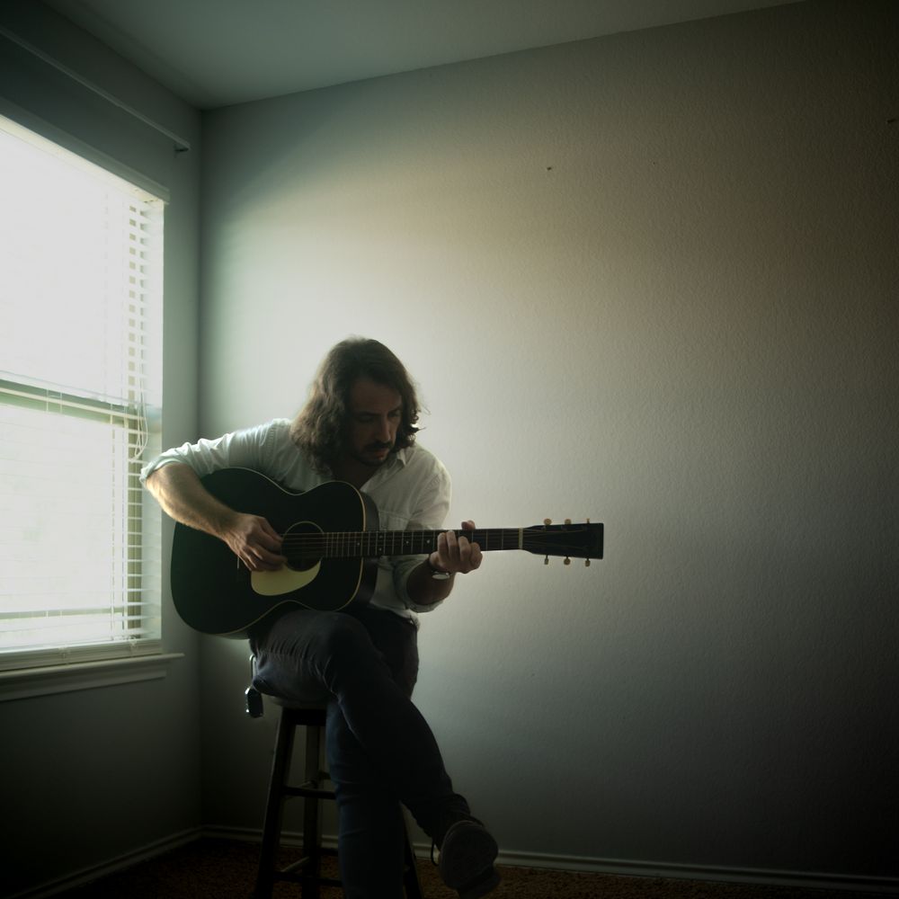 Official press photo of Andrew Savage, a folk and acoustic singer-songwriter from Austin, Texas, known for his emotive lyrics and dynamic live performances.