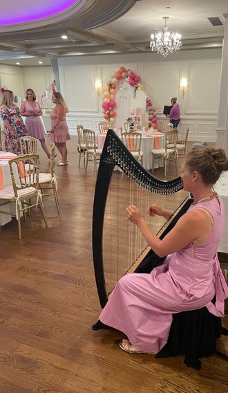 Harpist Shelley Otis performing at a baby shower at the Coachmen's Lodge in Bellingham MA