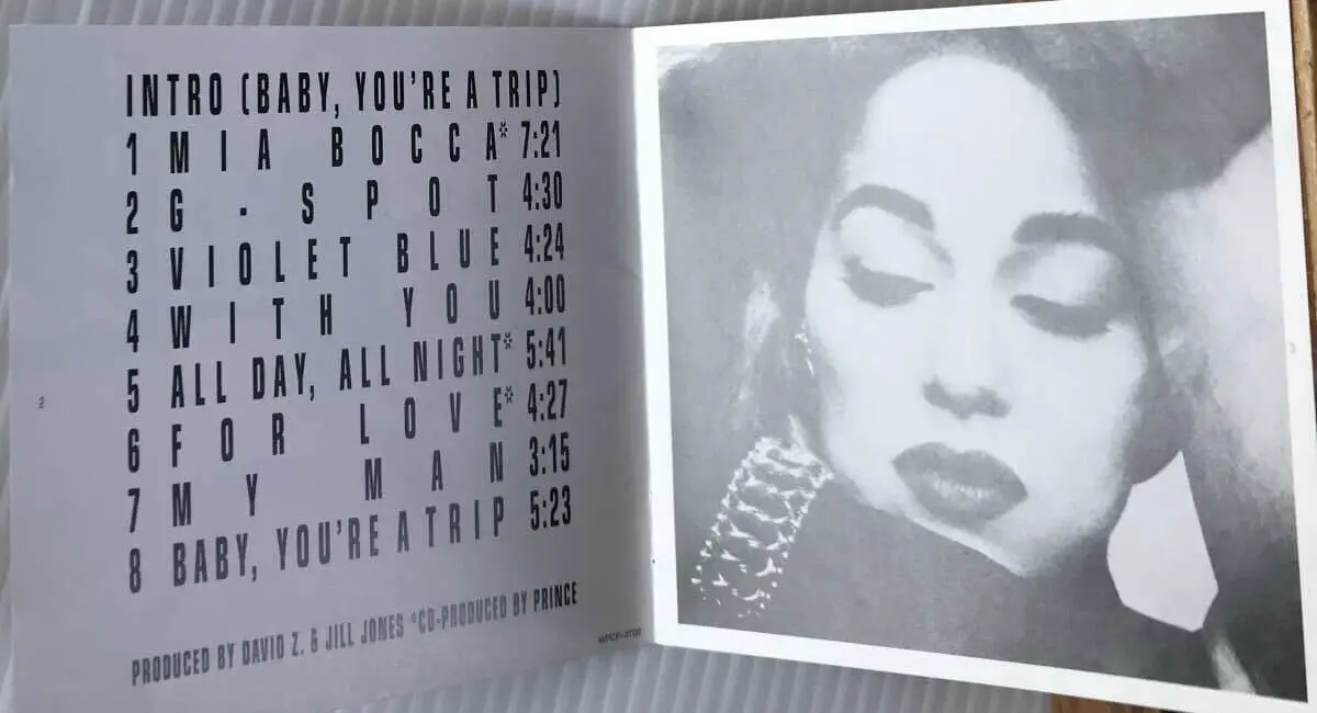 The back cover of Jill Jones' self-titled debut album, showing the tracklist including 'Mia Bocca' and 'Violet Blue' against a dark, stylized background.