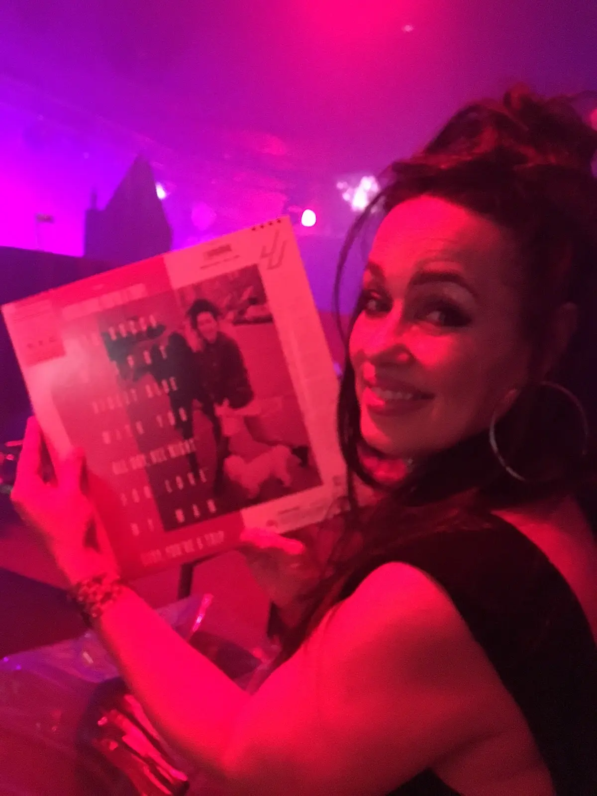 Jill Jones signing JJ Vicars' Japanese vinyl pressing of her debut album during a live appearance at Interbelt Nightclub in Akron, Ohio, 2017.