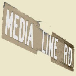 Media Line Road street sign on a brown background.