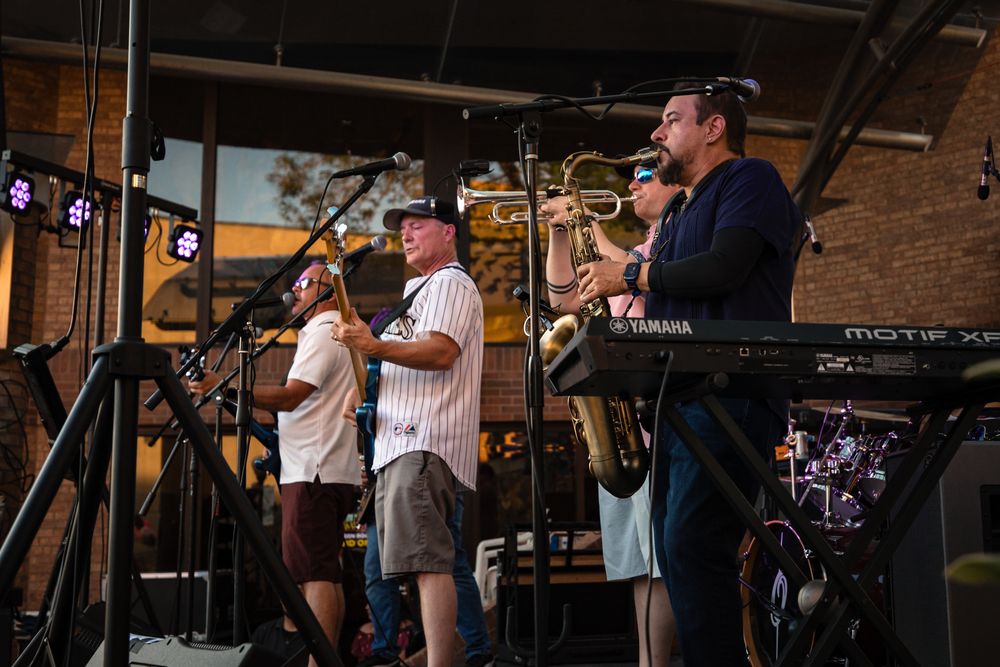 The Martini Shot live performance featuring horns up front delivering a high-energy party band experience