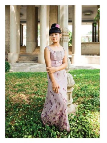 Classic dress in front of the French colonial building
