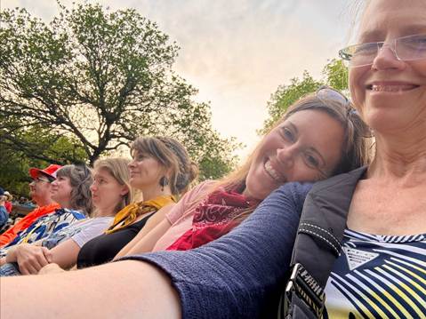 A group of women taking a selfie

AI-generated content may be incorrect.
