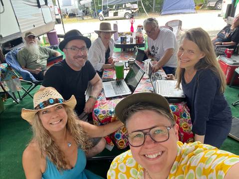 A group of people sitting around a table

AI-generated content may be incorrect.