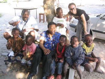 With the boys of the village.
