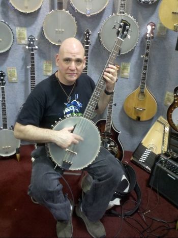 At NAMM checking out a Gold Tone bass banjo

