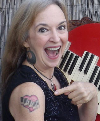 Me and my new tattoo. I have wanted a tattoo ever since I found out Janis Joplin had one, but it took me a long time to figure out what image I wanted.  Not sure why, since the perfect one had been staring me in the face the whole time.  I'm THRILLED with it!
