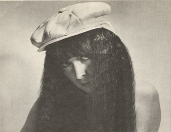 Hiding behind the hair... Maybe clothes make the man, but hats make the girl.
