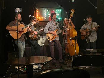 trio on stage with Josh Daniel and Pat Walters
