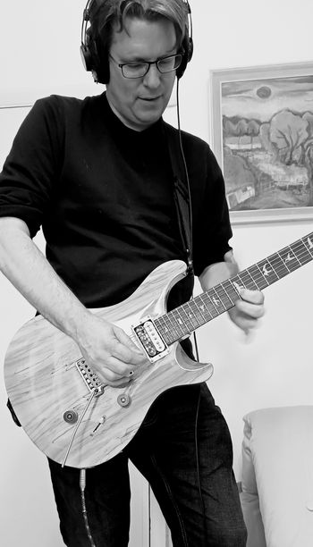 Malcolm twiddling on a very pretty spalted maple PRS 24 SE. Recording the guitar solo for 'eversion'. Photo by Mark Gatland.
