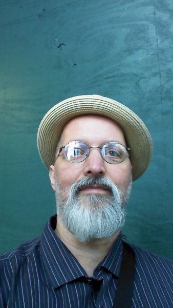 ME at Hanover House corner NYC I'm standing where Woody Guthrie wrote "This Land Is Your Land"
