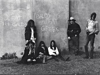 Oberon outside rehearsal pub in London. The wall has "Baldy is a Fat Greek", so we had to pose there
