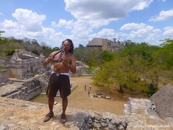 Playing on The Temple of Ek-Balaam "The Black Jaguar" Emiliano playing a Mayan triple-flute on the Mayan pyramids in The Yucatan, Mexico.

